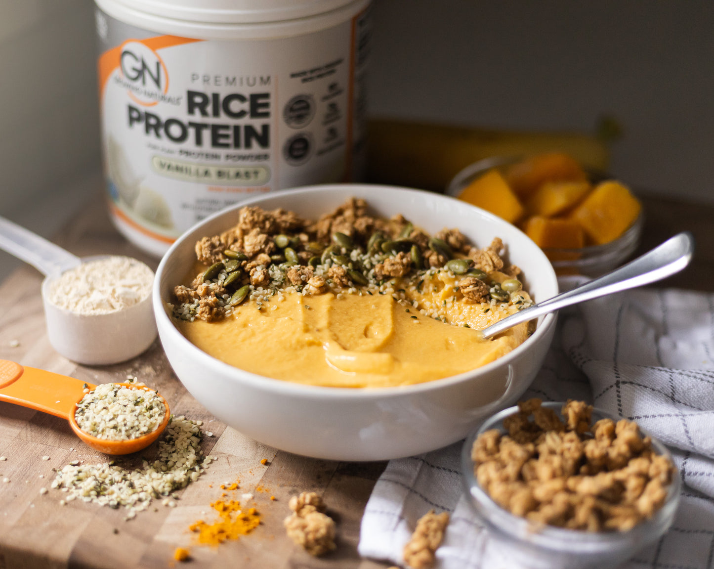 thick creamy mango turmeric smoothie bowl vegan