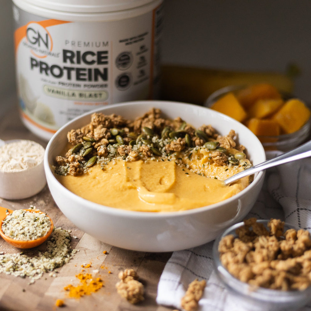 thick creamy mango turmeric smoothie bowl vegan